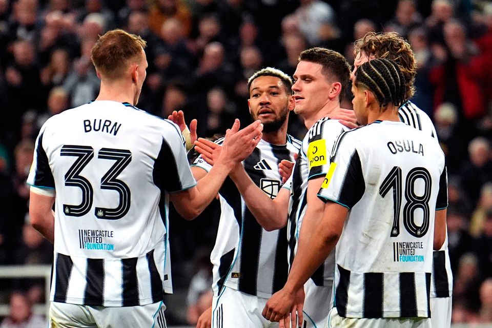Newcastle United's Sven Botman (centre right) celebrates scoring their side's third goal